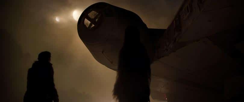 Solo A Star Wars Story Trailer Dissection - Hand and Chewiee infront of the Falcon