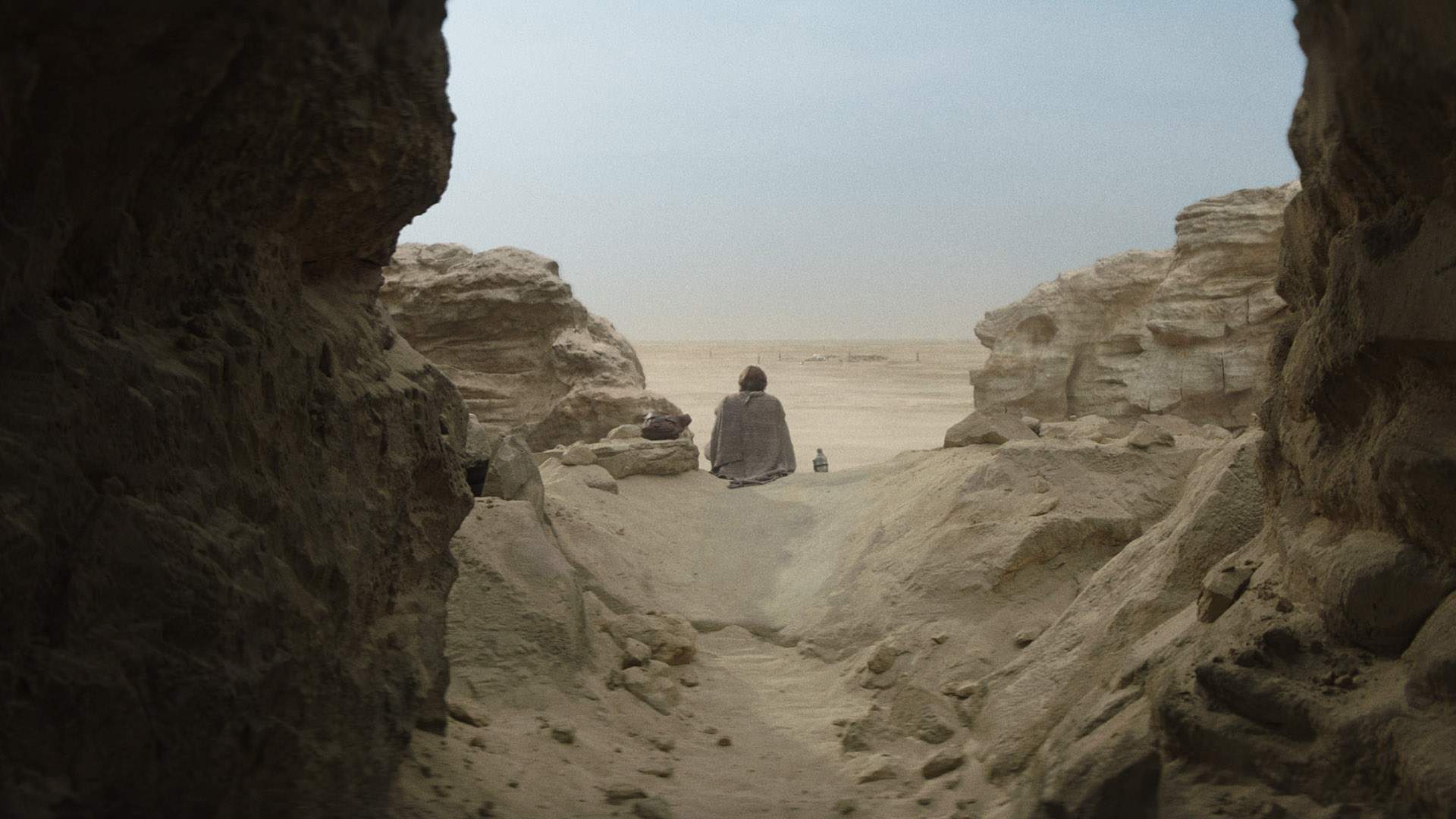 Obi-Wan staring watching the farm from afar