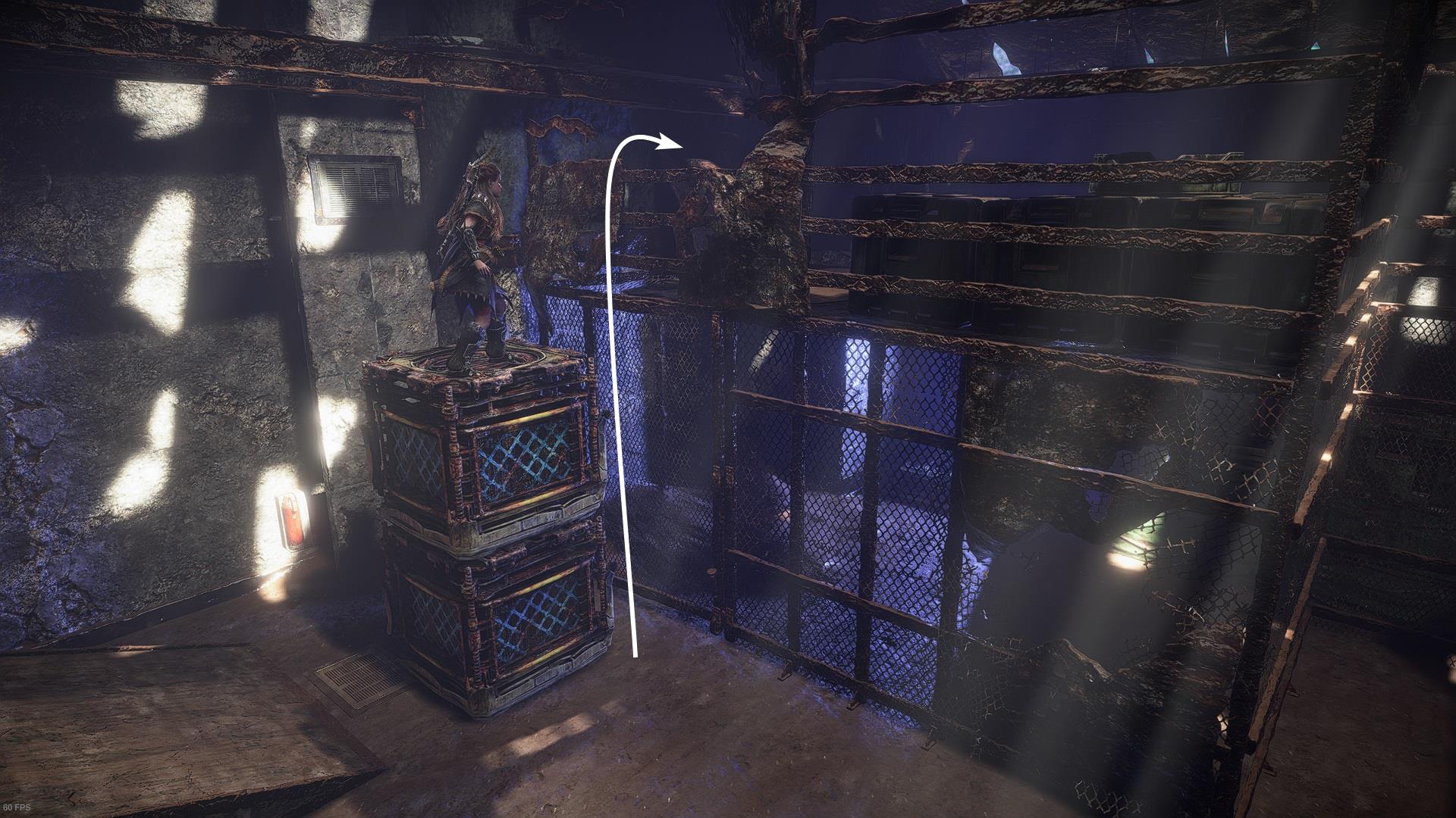 Aloy climbs on the stacked cubes to get over the fence