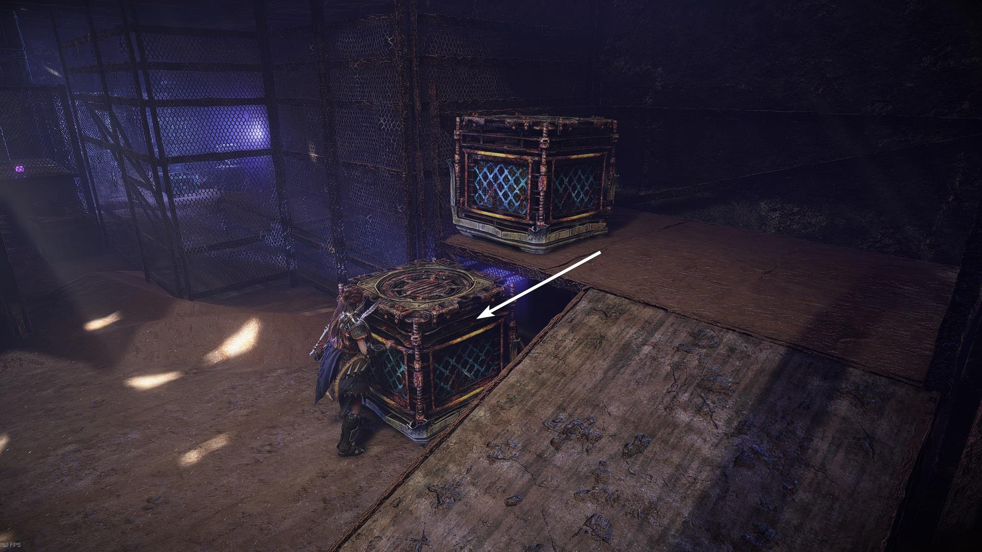 Aloy positions the one crate over the other