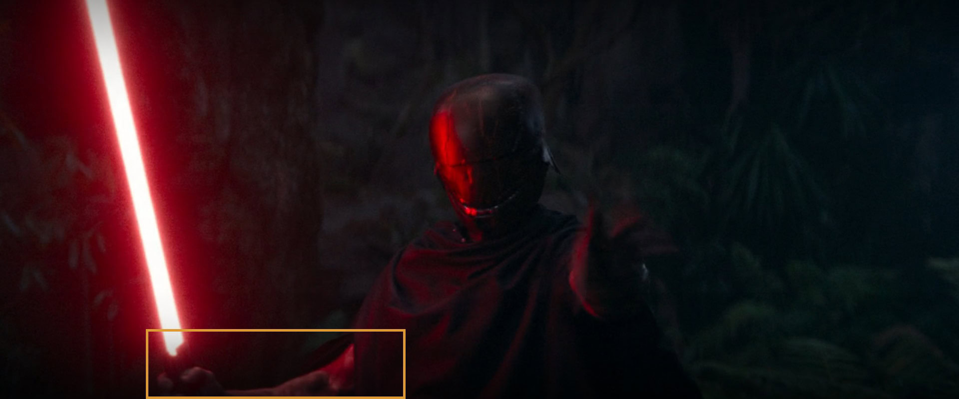 The right hand of the dark figure looks burnt, not dark
