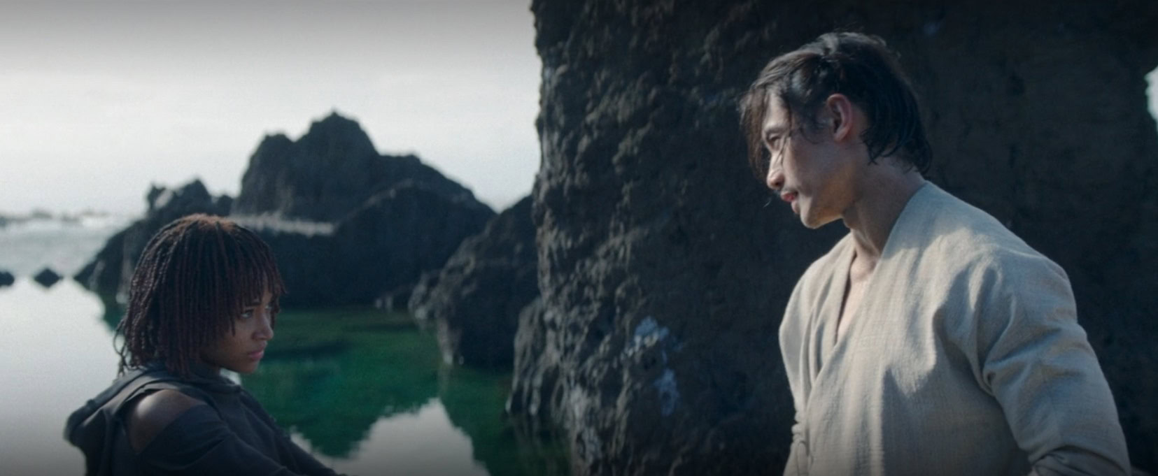 Osha confronts Qimir on the island of the unknown planet