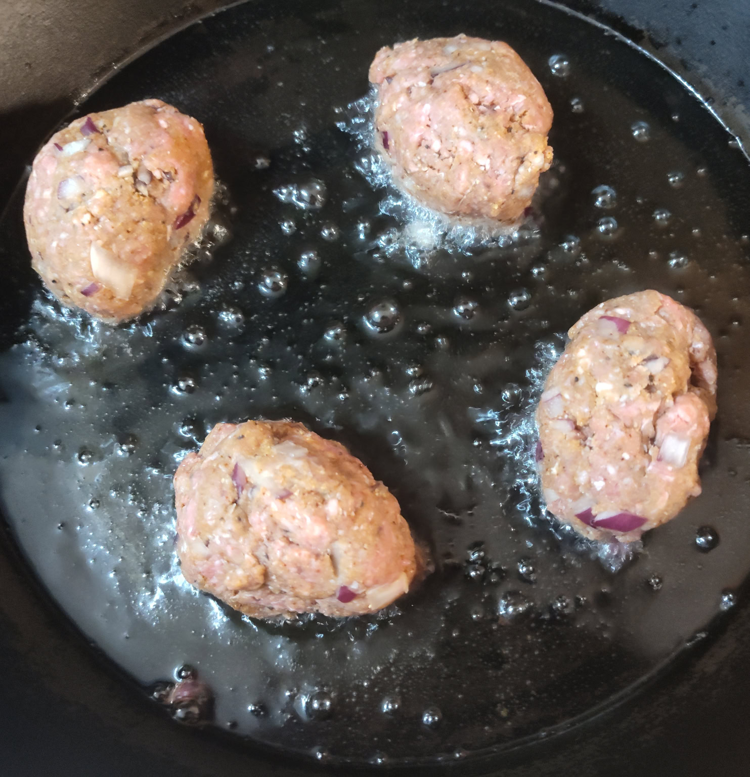 Frying Meatballs in a pan with oil