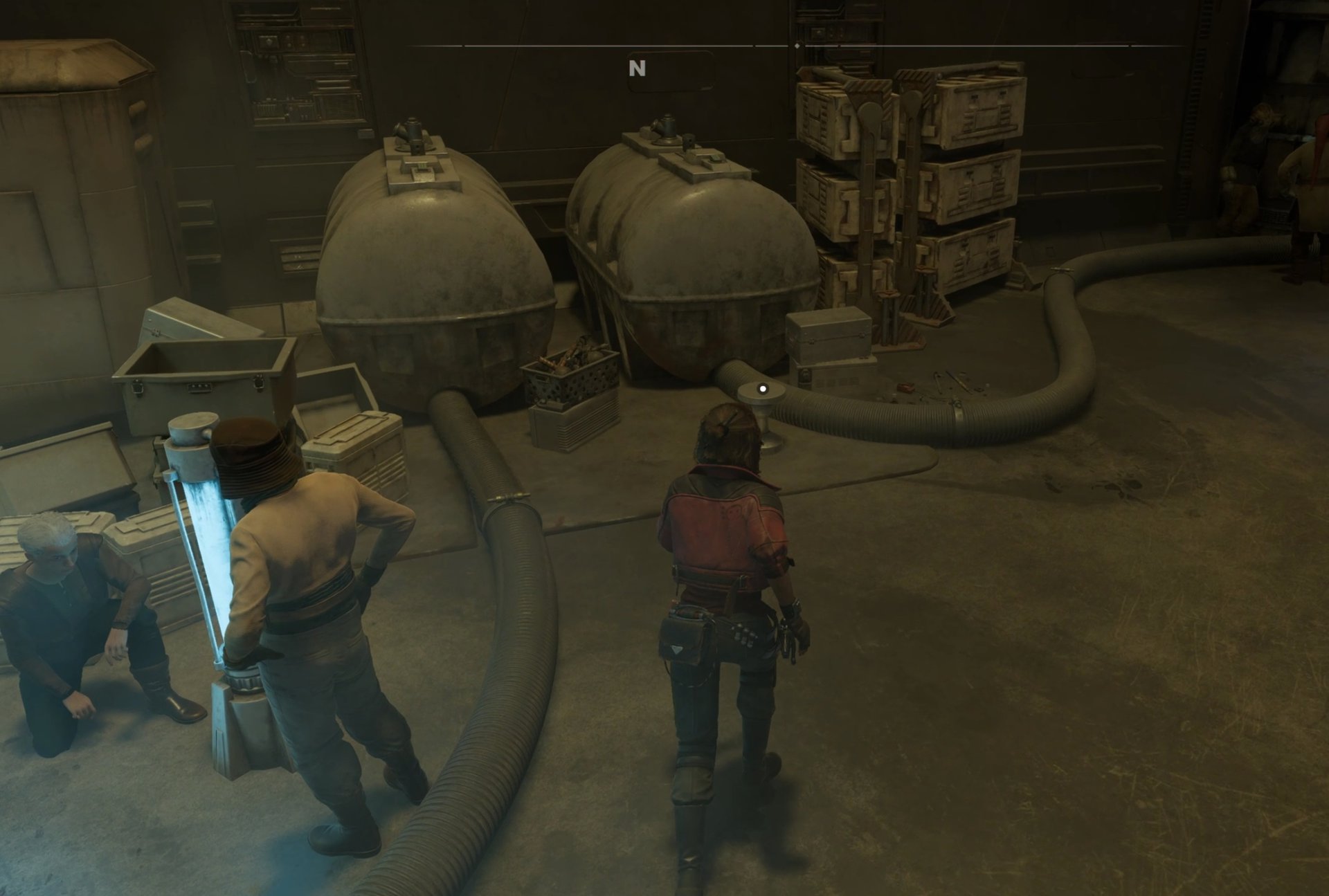 Kay listens in on a conversation in the hangar