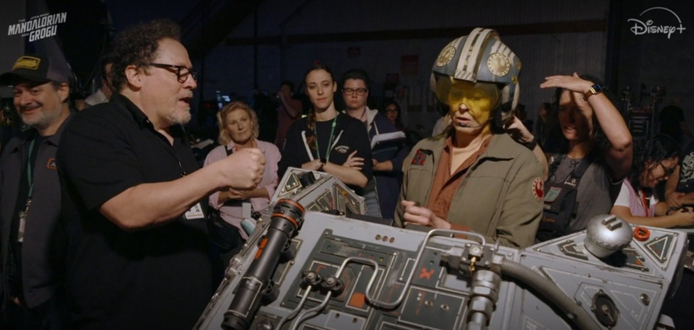 Jon Favreau talking to Sigourney Weaver on the set of The Mandalorian and Grogu movie