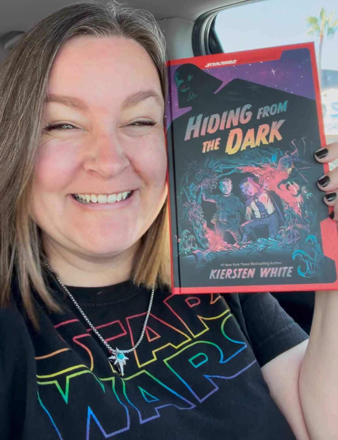 Kiersten White holding the book Hiding from the Dark
